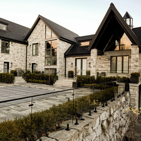 Standard glass fence kit on stone patio